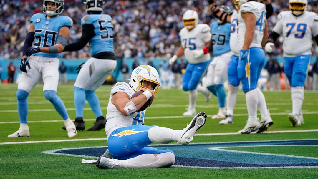Chargers quarterback Justin Herbert slides for a touchdown against the Titans in Week 9.