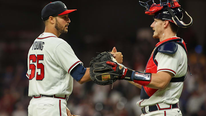 May 9, 2023; Atlanta, Georgia, USA; Atlanta Braves relief pitcher Danny Young (65) and catcher Sean Murphy (12) celebrate after a victory against the Boston Red Sox at Truist Park.