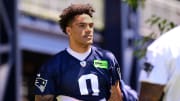 Jun 10, 2024; Foxborough, MA, USA; New England Patriots cornerback Christian Gonzalez (0) walks to the practice fields for minicamp at Gillette Stadium. Mandatory Credit: Eric Canha-USA TODAY Sports