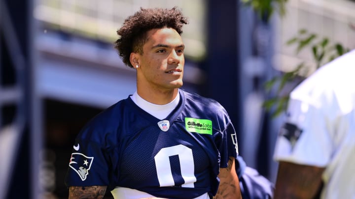 Jun 10, 2024; Foxborough, MA, USA; New England Patriots cornerback Christian Gonzalez (0) walks to the practice fields for minicamp at Gillette Stadium. Mandatory Credit: Eric Canha-USA TODAY Sports