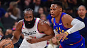 Dec 1, 2024; Inglewood, California, USA; Los Angeles Clippers guard James Harden (1) moves the ball against Denver Nuggets guard Russell Westbrook (4) during the first half at Intuit Dome. Mandatory Credit: Gary A. Vasquez-Imagn Images