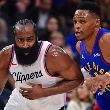 Dec 1, 2024; Inglewood, California, USA; Los Angeles Clippers guard James Harden (1) moves the ball against Denver Nuggets guard Russell Westbrook (4) during the first half at Intuit Dome. Mandatory Credit: Gary A. Vasquez-Imagn Images
