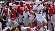 Texas Longhorns quarterback Arch Manning (16) rushes the ball against the Ohio State Buckeyes.