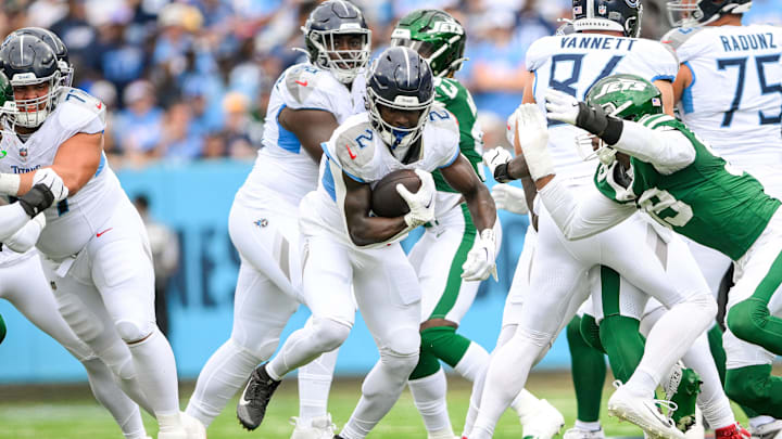 Sep 15, 2024; Nashville, Tennessee, USA;  Tennessee Titans running back Tyjae Spears (2) runs the ball against the New York Jets during the first half during the first half at Nissan Stadium. Mandatory Credit: Steve Roberts-Imagn Images