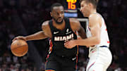 Mar 12, 2025; Miami, Florida, USA;  Miami Heat forward Andrew Wiggins (22) drives past LA Clippers guard Bogdan Bogdanovic (10) during the second half at Kaseya Center. Mandatory Credit: Jim Rassol-Imagn Images