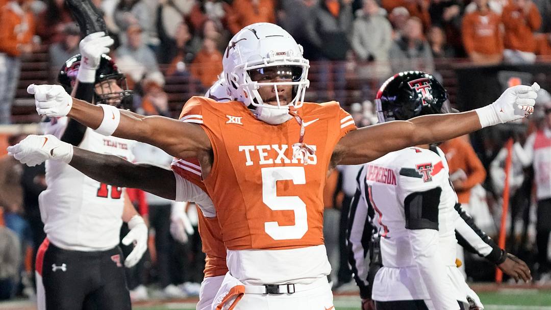 Former Texas Longhorns wide receivers Xavier Worthy (1) and AD Mitchell (5) celebrate after Worthy scored a touchdown during the second half against the Texas Tech Red Raiders at Darrell K Royal-Texas Memorial Stadium.