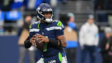 Nov 24, 2024; Seattle, Washington, USA; Seattle Seahawks quarterback Geno Smith looks to pass the ball against the Arizona Cardinals.