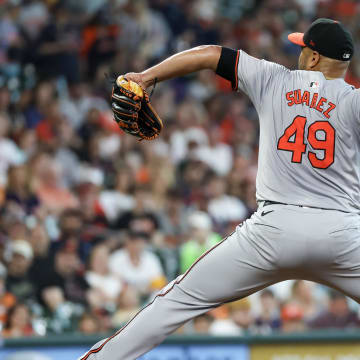 Jun 23, 2024; Houston, Texas, USA;  Baltimore Orioles starting pitcher Albert Suarez (49) pitches against the Houston Astros in the first inning at Minute Maid Park.