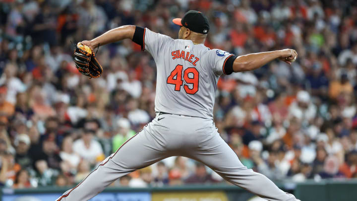 Jun 23, 2024; Houston, Texas, USA;  Baltimore Orioles starting pitcher Albert Suarez (49) pitches against the Houston Astros in the first inning at Minute Maid Park.