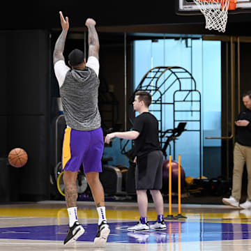 Jan 29, 2020; Los Angeles, California, USA; Los Angeles Lakers center DeMarcus Cousins shoots at the conclusion of a workout at Los Angeles Lakers Training Facility. The Lakers practice was the first since the death of Kobe Bryant. Bryant, who played his entire career with the Lakers, died with his daughter and 7 others in a helicopter crash Sunday Jan. 26, 2020. Mandatory Credit: Robert Hanashiro-Imagn Images