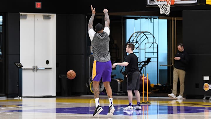 Jan 29, 2020; Los Angeles, California, USA; Los Angeles Lakers center DeMarcus Cousins shoots at the conclusion of a workout at Los Angeles Lakers Training Facility. The Lakers practice was the first since the death of Kobe Bryant. Bryant, who played his entire career with the Lakers, died with his daughter and 7 others in a helicopter crash Sunday Jan. 26, 2020. Mandatory Credit: Robert Hanashiro-Imagn Images