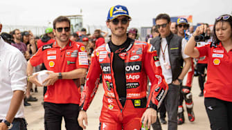 Apr 15, 2023; Austin, TX, USA;  Luca Marini (10) of Italy and Mooney VR46 Racing Team and Francesco Bagnaia (1) of Italy and Ducati Lenovo Team finish the Qualifying of the MotoGP Red Bull Grand Prix of the Americas on April 15, 2023, at Circuit of The Americas in Austin, Texas. at Circuit of the Americas. Mandatory Credit: Dustin Safranek-Imagn Images