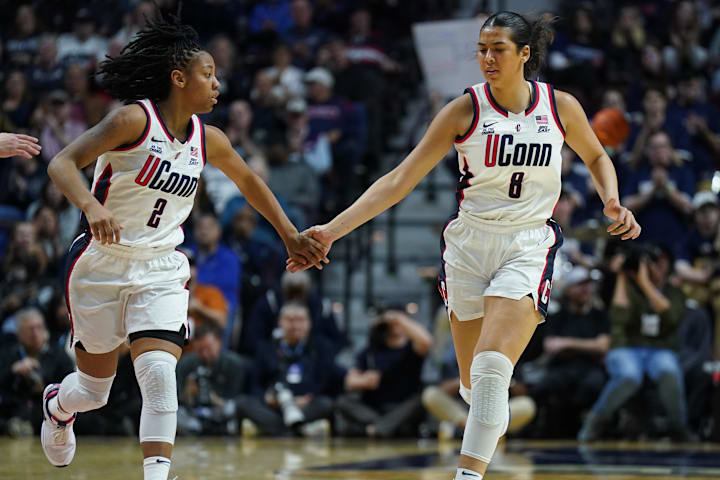 UConn Huskies center Jana El Alfy and guard KK Arnold react after a play against the St. John's Red Storm.