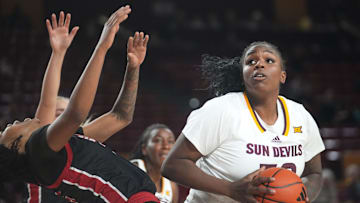 ASU Sun Devils center Nevaeh Parkinson (32) spins into the lane as Jacksonville State Gamecocks forward Asia Barclay (35) is called for a technical on her flop at Desert Financial Arena in Tempe on Nov. 4, 2024.