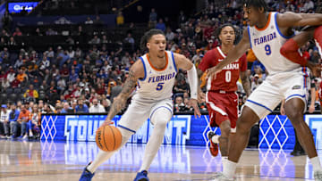 Mar 15, 2025; Nashville, TN, USA;  Florida Gators guard Will Richard (5) drives to the basket against the Alabama Crimson Tide during the first half at Bridgestone Arena. Mandatory Credit: Steve Roberts-Imagn Images