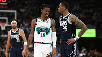 Apr 18, 2025; Memphis, Tennessee, USA; Memphis Grizzlies guard Ja Morant (12) and Dallas Mavericks forward P.J. Washington (25) look on during the fourth quarter at FedExForum. Mandatory Credit: Petre Thomas-Imagn Images