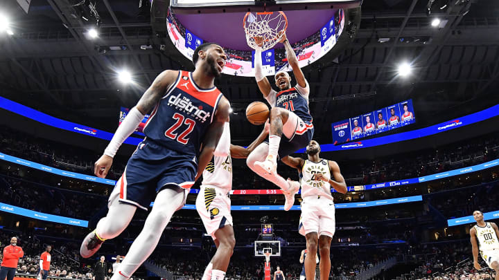 Feb 11, 2023; Washington, District of Columbia, USA; Washington Wizards center Daniel Gafford (21) dunks as guard Monte Morris (22) celebrates against the Indiana Pacers at Capital One Arena. Mandatory Credit: Brad Mills-USA TODAY Sports