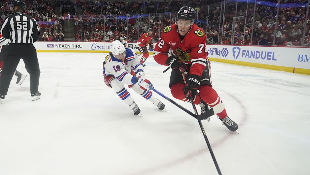 Jan 5, 2025; Chicago, Illinois, USA; New York Rangers left wing Artemi Panarin (10) defends Chicago Blackhawks defenseman Alex Vlasic (72) during the third period at United Center. Mandatory Credit: David Banks-Imagn Images