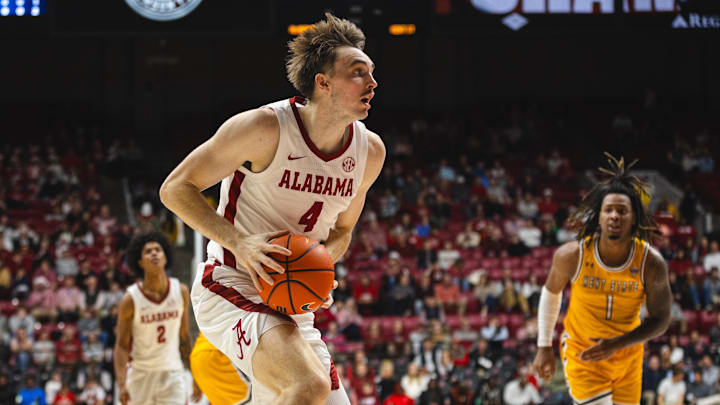 Dec 22, 2024; Tuscaloosa, Alabama, USA; Alabama Crimson Tide forward Grant Nelson (4) drives the ball against the Kent State Golden Flashes during the second half at Coleman Coliseum. Mandatory Credit: Will McLelland-Imagn Images
