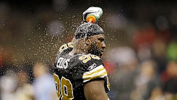 November 06, 2011; New Orleans, LA, USA; New Orleans Saints defensive tackle Sedrick Ellis (98) pours water over his head during warmups prior to kickoff against the Tampa Bay Buccaneers at the Mercedes-Benz Superdome. Mandatory Credit: Crystal LoGiudice-Imagn Images
