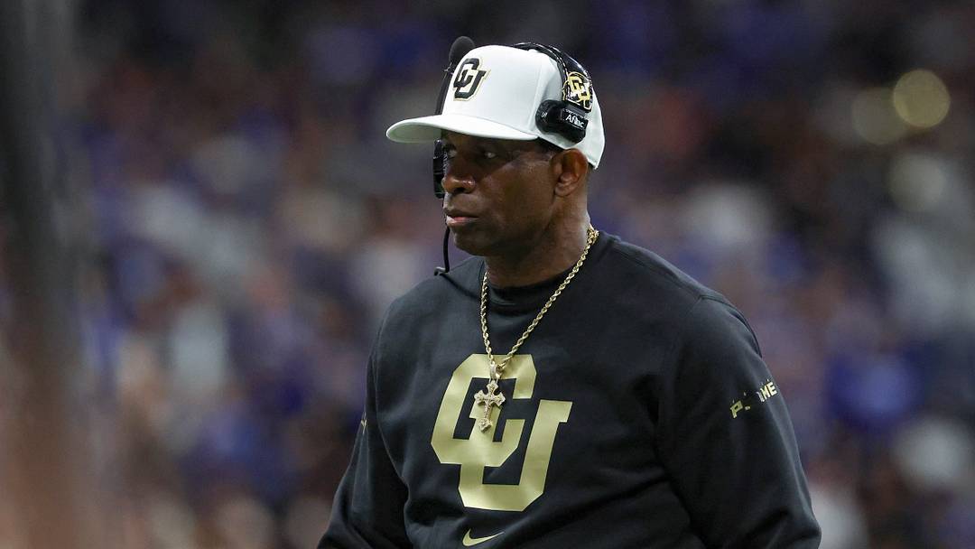 Dec 28, 2024; San Antonio, TX, USA; Colorado Buffaloes head coach Deion Sanders walks on the field during the game against the Brigham Young Cougars at Alamodome. 