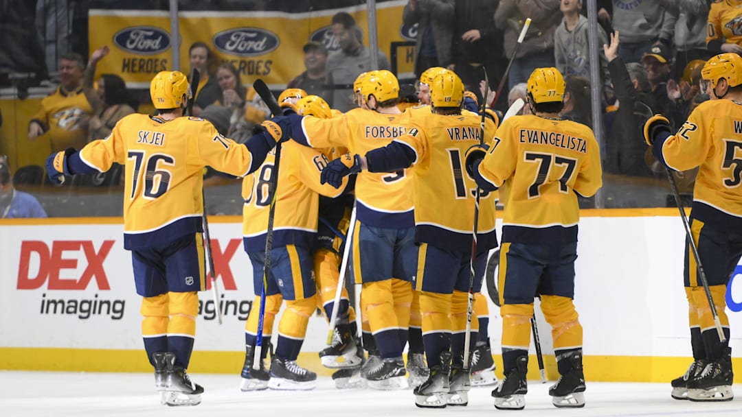 Apr 8, 2025; Nashville, Tennessee, USA;  Nashville Predators center Fedor Svechkiv (40) celebrates his game=winning goal with his teammates  during the over time period at Bridgestone Arena. Mandatory Credit: Steve Roberts-Imagn Images