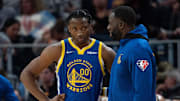 October 30, 2021; San Francisco, California, USA; Golden State Warriors forward Jonathan Kuminga (00) listens to forward Draymond Green (23) during the fourth quarter against the Oklahoma City Thunder at Chase Center. Mandatory Credit: Kyle Terada-Imagn Images