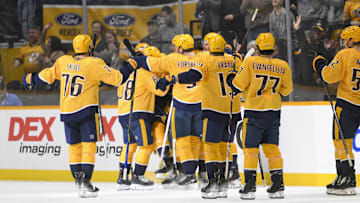 Apr 8, 2025; Nashville, Tennessee, USA;  Nashville Predators center Fedor Svechkiv (40) celebrates his game=winning goal with his teammates  during the over time period at Bridgestone Arena. Mandatory Credit: Steve Roberts-Imagn Images