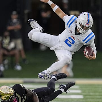 Sep 14, 2024; Winston-Salem, North Carolina, USA;  Wake Forest Demon Deacons defensive back Jamare Glasker (25) upends Mississippi Rebels quarterback Jaxson Dart (2) during the first half at Allegacy Federal Credit Union Stadium. Mandatory Credit: Jim Dedmon-Imagn Images