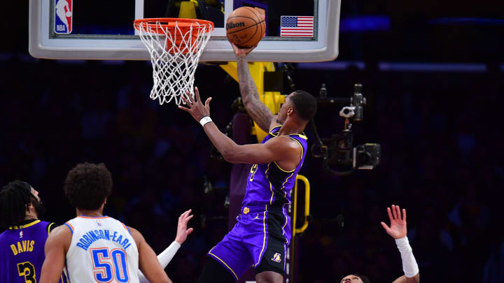 Mar 24, 2023; Los Angeles, California, USA; Los Angeles Lakers guard Lonnie Walker IV (4) shoots against the Oklahoma City Thunder during the first half at Crypto.com Arena. 