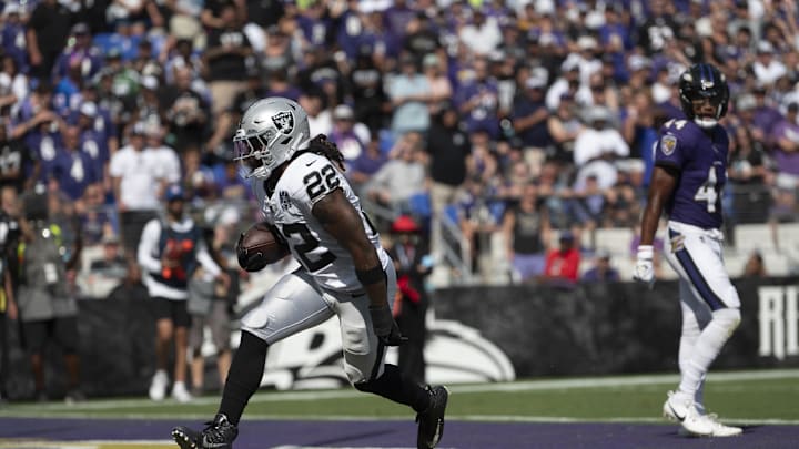 Sep 15, 2024; Baltimore, Maryland, USA;  Las Vegas Raiders running back Alexander Mattison (22) rushes for a touchdown during the second half against the Baltimore Ravens at M&T Bank Stadium. Mandatory Credit: Tommy Gilligan-Imagn Images