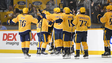 Apr 8, 2025; Nashville, Tennessee, USA;  Nashville Predators center Fedor Svechkiv (40) celebrates his game=winning goal with his teammates  during the over time period at Bridgestone Arena. Mandatory Credit: Steve Roberts-Imagn Images