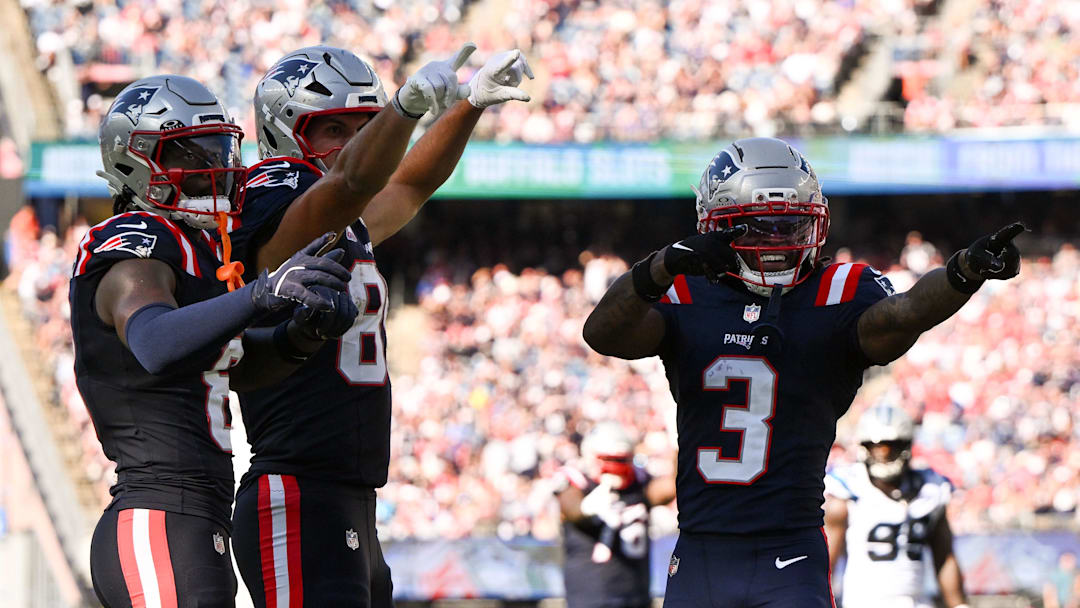 New England Patriots wide receiver Stefon Diggs, left, tight end Hunter Henry, middle, and wide receiver Demario Douglas