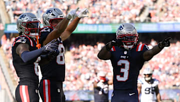 New England Patriots wide receiver Stefon Diggs, left, tight end Hunter Henry, middle, and wide receiver Demario Douglas