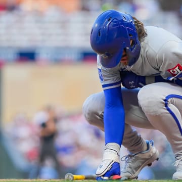 Aug 12, 2024; Minneapolis, Minnesota, USA; Kansas City Royals shortstop Bobby Witt Jr. (7) is hit by a pitch against the Minnesota Twins in the fifth inning at Target Field. Mandatory Credit: Brad Rempel-USA TODAY Sports