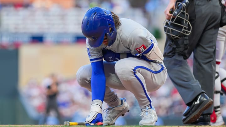 Aug 12, 2024; Minneapolis, Minnesota, USA; Kansas City Royals shortstop Bobby Witt Jr. (7) is hit by a pitch against the Minnesota Twins in the fifth inning at Target Field. Mandatory Credit: Brad Rempel-USA TODAY Sports