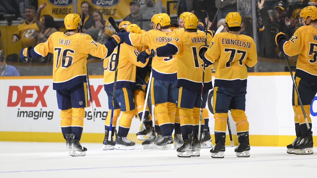 Apr 8, 2025; Nashville, Tennessee, USA;  Nashville Predators center Fedor Svechkov (40) celebrates his game=winning goal with his teammates  during the over time period at Bridgestone Arena. Mandatory Credit: Steve Roberts-Imagn Images