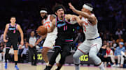 Nov 17, 2025; Miami, Florida, USA; Miami Heat forward Jaime Jaquez Jr. (11) drives to the basket against New York Knicks guard Josh Hart (3) during the first quarter at Kaseya Center. Mandatory Credit: Sam Navarro-Imagn Images