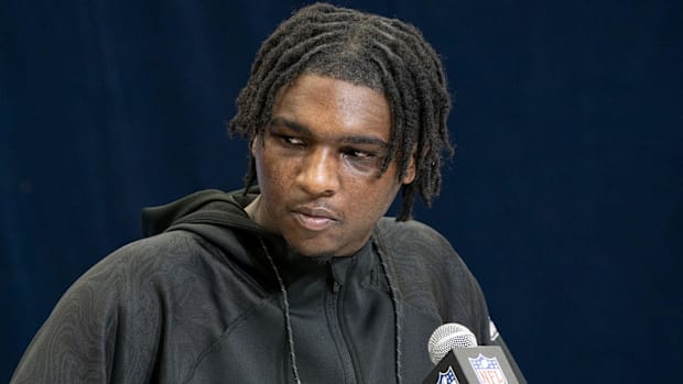 Miami quarterback Cam Ward (QB15) talks to the press during the 2025 NFL Combine at Indiana Convention Center. 