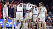 Feb 5, 2025; Piscataway, New Jersey, USA; Illinois Fighting Illini center Tomislav Ivisic (13) is helped off the court by teammates during the second half against the Rutgers Scarlet Knights at Jersey Mike's Arena. Mandatory Credit: Vincent Carchietta-Imagn Images