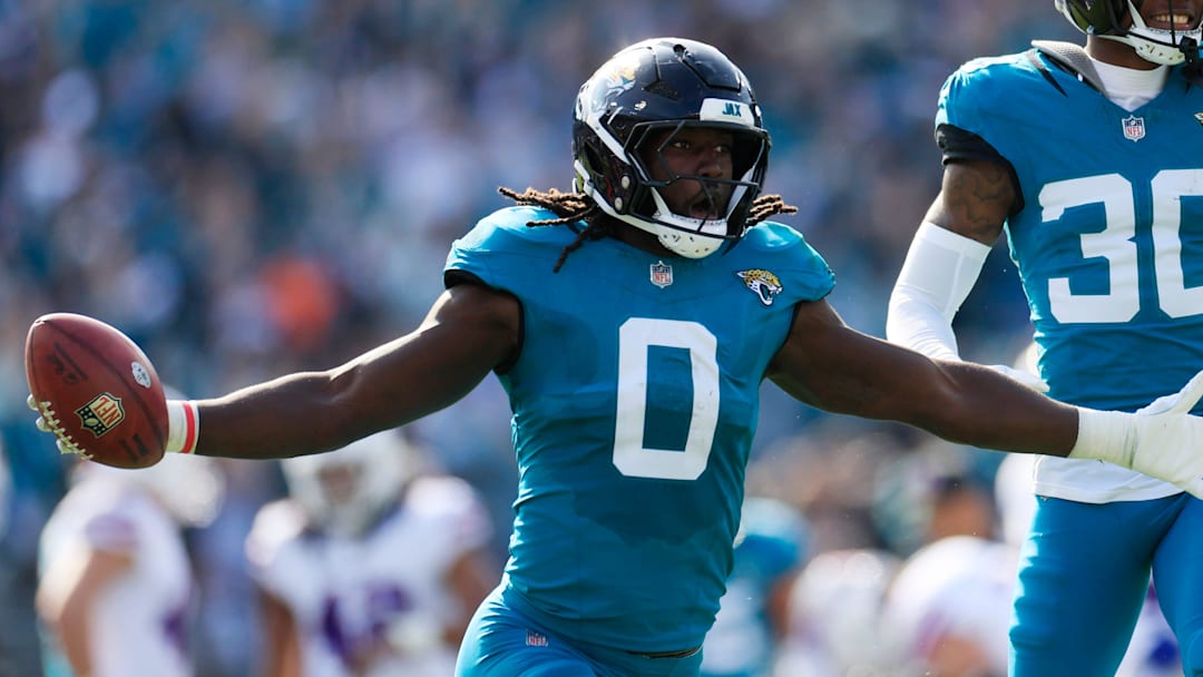 Jacksonville Jaguars linebacker Devin Lloyd (0) celebrates a fumble recovery with cornerback Montaric Brown (30) during the second quarter of an NFL football AFC Wild Card playoff matchup, Sunday, Jan. 11, 2026, in Jacksonville, Fla. [Corey Perrine/Florida Times-Union]