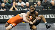 Mar 18, 2023; Tulsa, OK, USA;  Arizona State wrestler Michael McGee (right) wrestles Oklahoma State wrestler Daton Fix in the 133 pound weight class third place match  during the NCAA Wrestling Championships at the BOK Center. Mandatory Credit: Brett Rojo-Imagn Images
