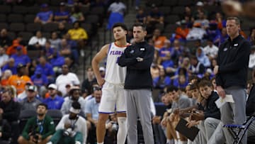 Nov 4, 2024; Jacksonville, Florida, USA; Florida Gators guard Walter Clayton Jr. (1) and head coach Todd Golden during the game against South Florida Bulls during the first half at VyStar Veterans Memorial Arena. Mandatory Credit: Morgan Tencza-Imagn Images