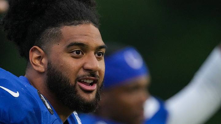 Indianapolis Colts defensive end JT Tuimoloau sings while warming-up Thursday, July 31, 2025, during Colts Training Camp 