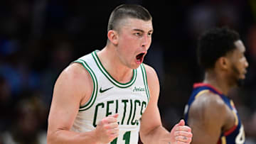 Nov 30, 2025; Cleveland, Ohio, USA; Boston Celtics guard Payton Pritchard (11) reacts after making a three point basket during the second half against the Cleveland Cavaliers at Rocket Arena. Mandatory Credit: David Dermer-Imagn Images