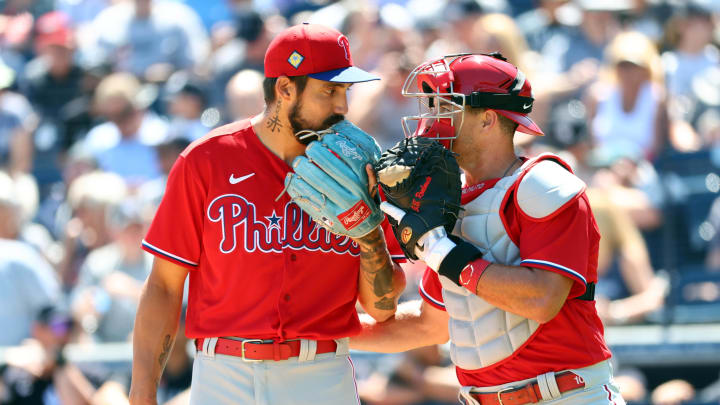 Mar 21, 2022; Tampa, Florida, USA; Philadelphia Phillies pitcher Hans Crouse (51) talks with catcher J.T. Realmuto (10) during the first inning against the New York Yankees during spring training at George M. Steinbrenner Field. Mandatory Credit: Kim Klement-USA TODAY Sports