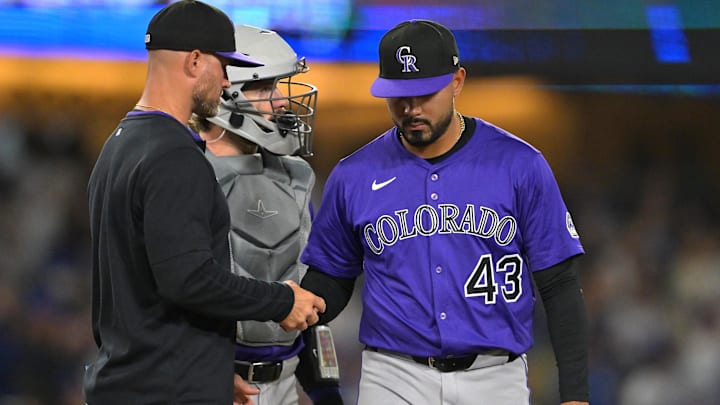 Sep 10, 2025; Los Angeles, California, USA; Colorado Rockies interim manager Warren Schaeffer (34) pulls relief pitcher Anthony Molina (43) from the game after giving up a grand slam home run to Los Angeles Dodgers shortstop Mookie Betts (50) during the eighth inning at Dodger Stadium. 