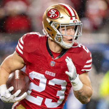January 20, 2024; Santa Clara, CA, USA; San Francisco 49ers running back Christian McCaffrey (23) runs the ball against the Green Bay Packers during the first quarter in a 2024 NFC divisional round game at Levi's Stadium. Mandatory Credit: Kyle Terada-USA TODAY Sports