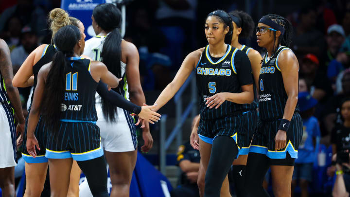 May 15, 2024; Arlington, Texas, USA;  Chicago Sky forward Angel Reese (5) celebrates with Chicago Sky guard Dana Evans (11) during the first half against the Dallas Wings at College Park Center. Mandatory Credit: Kevin Jairaj-USA TODAY Sports