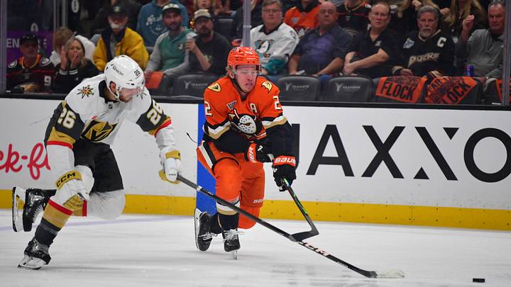 May 8, 2026; Anaheim, California, USA; Vegas Golden Knights center Nic Dowd (26) plays for the puck against Anaheim Ducks defenseman Jackson LaCombe (2) during the first period in game three of the second round of the 2026 Stanley Cup Playoffs at Honda Center. Mandatory Credit: Gary A.
Vasquez-Imagn Images